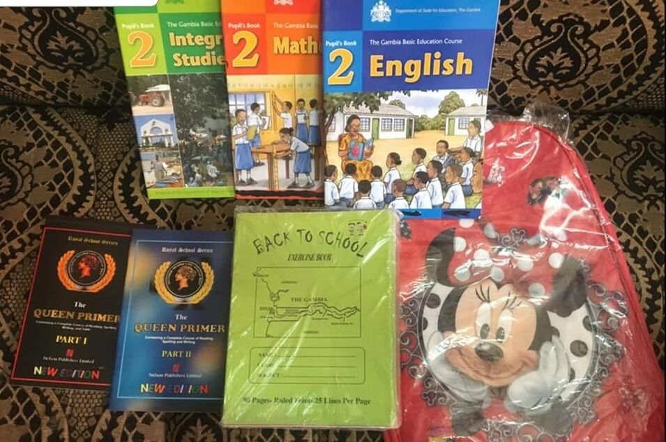 supplies: books, pen, pencils and micky mouse bag