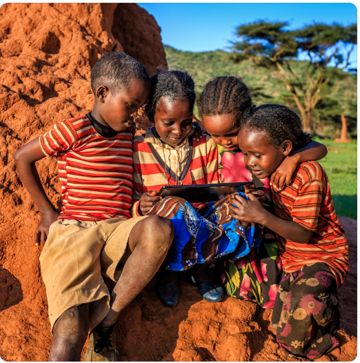 Children in African using digital tablet