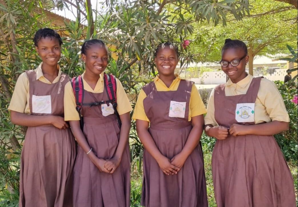4 Gambian girl students standing beside each other