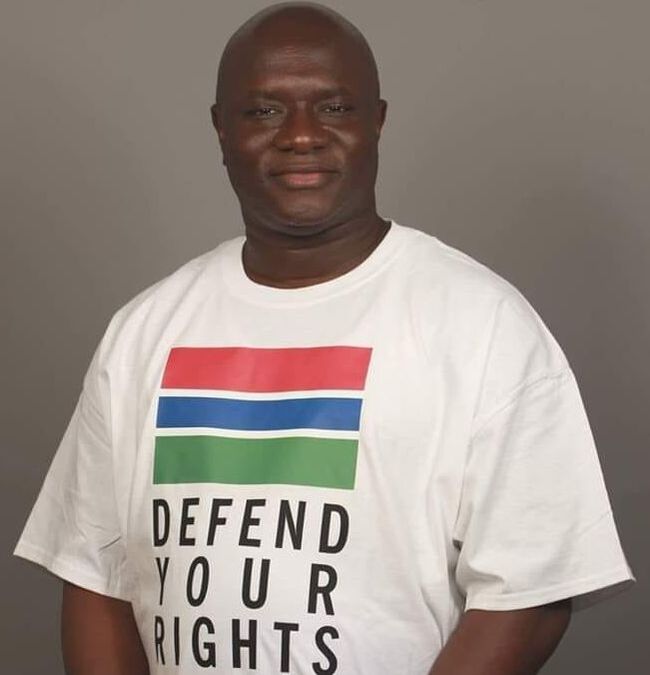 A man standing wearing human rights tshirt